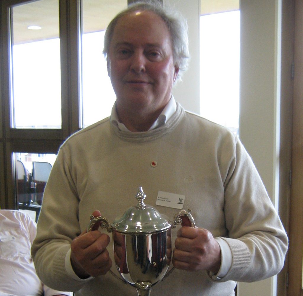 Robert Brooke holding the Statistician of the Year trophy at the 2012 AGM